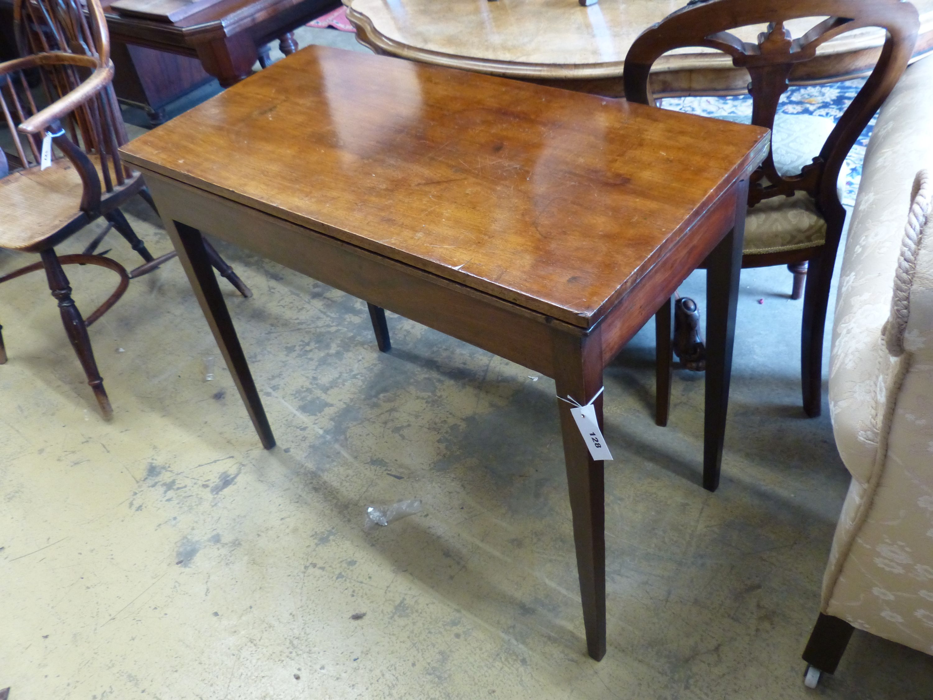 A George III rectangular mahogany folding card table, height 73cm, width 92cm, depth 45cm